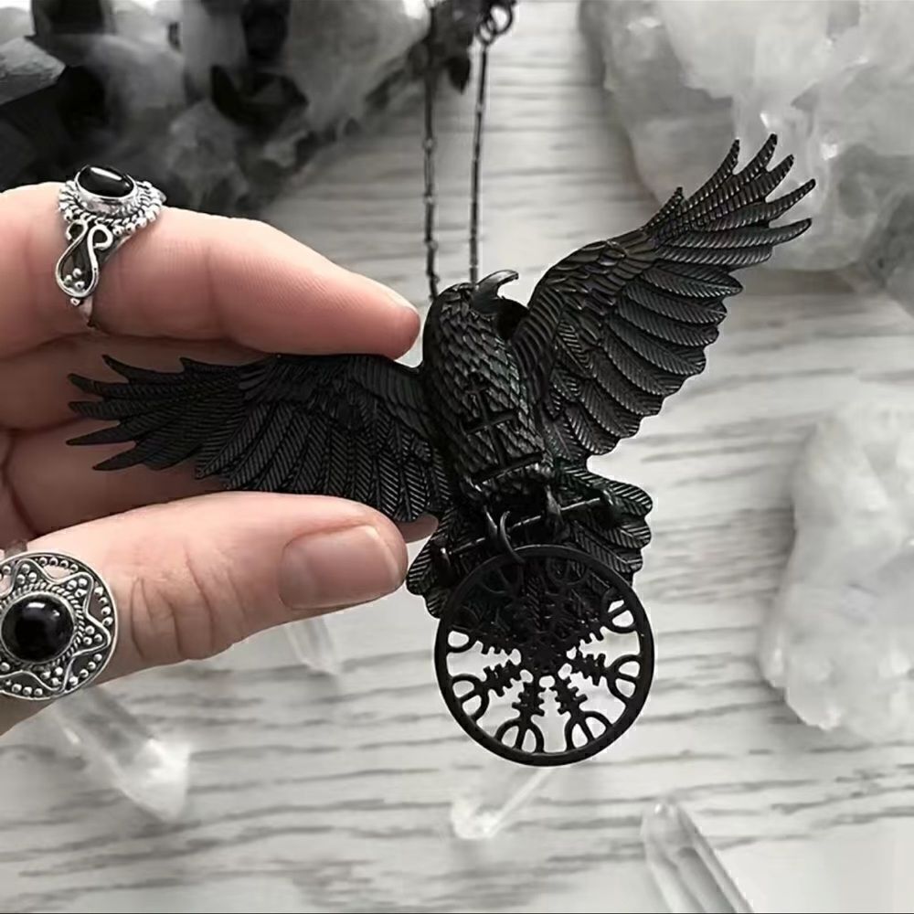 Black raven pendant necklace with black link chain.